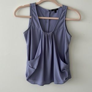 Silk light, purple sleeveless top that buttons down in the back